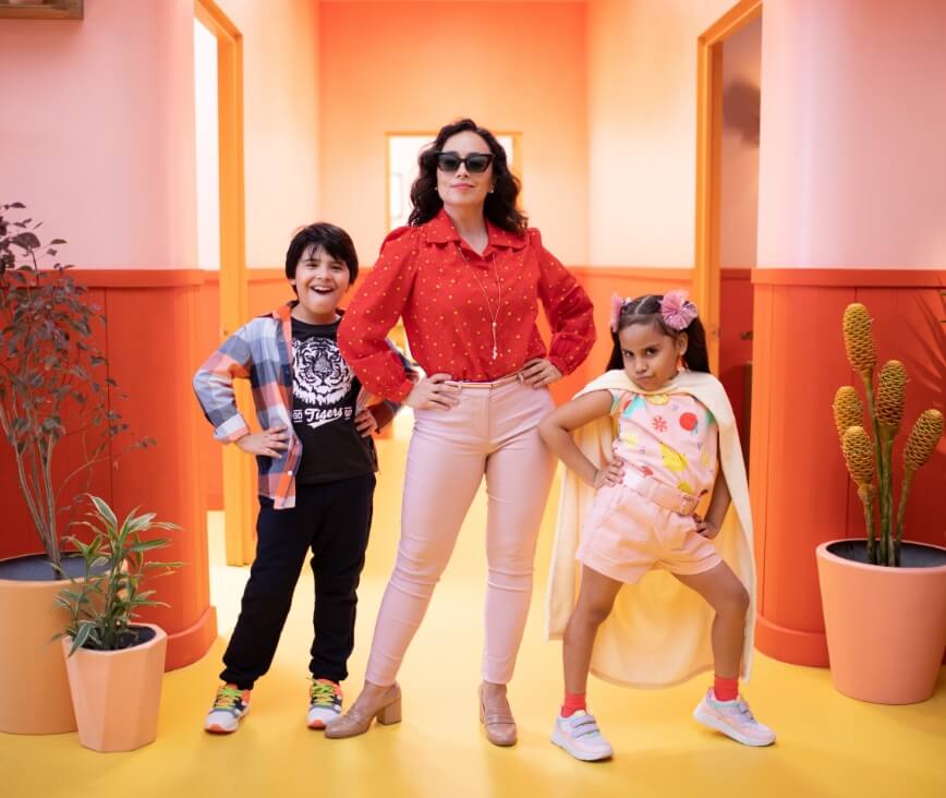 Mom and kids looking cool in hallway