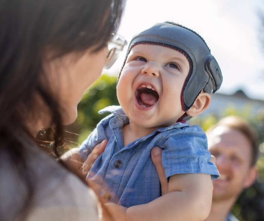 Mom and child wearing head orthotic